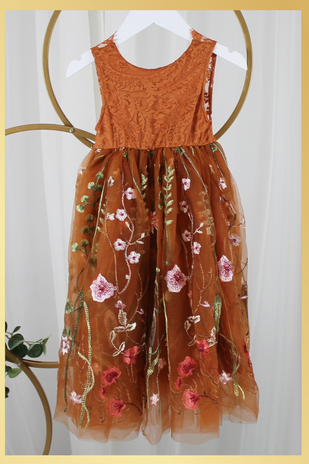 Burnt orange floral embroidery girls' dress. Sleeveless lace sleeves with a floral full length style. perfect for flower girls and special occasions. sizes for babies, toddlers and preteens.