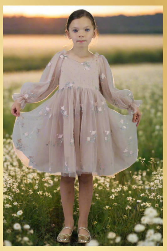 Champagne flower girl dress with long sleeve tulle sleeves. made with a tulip embroidery flower and swiss dot pattern.