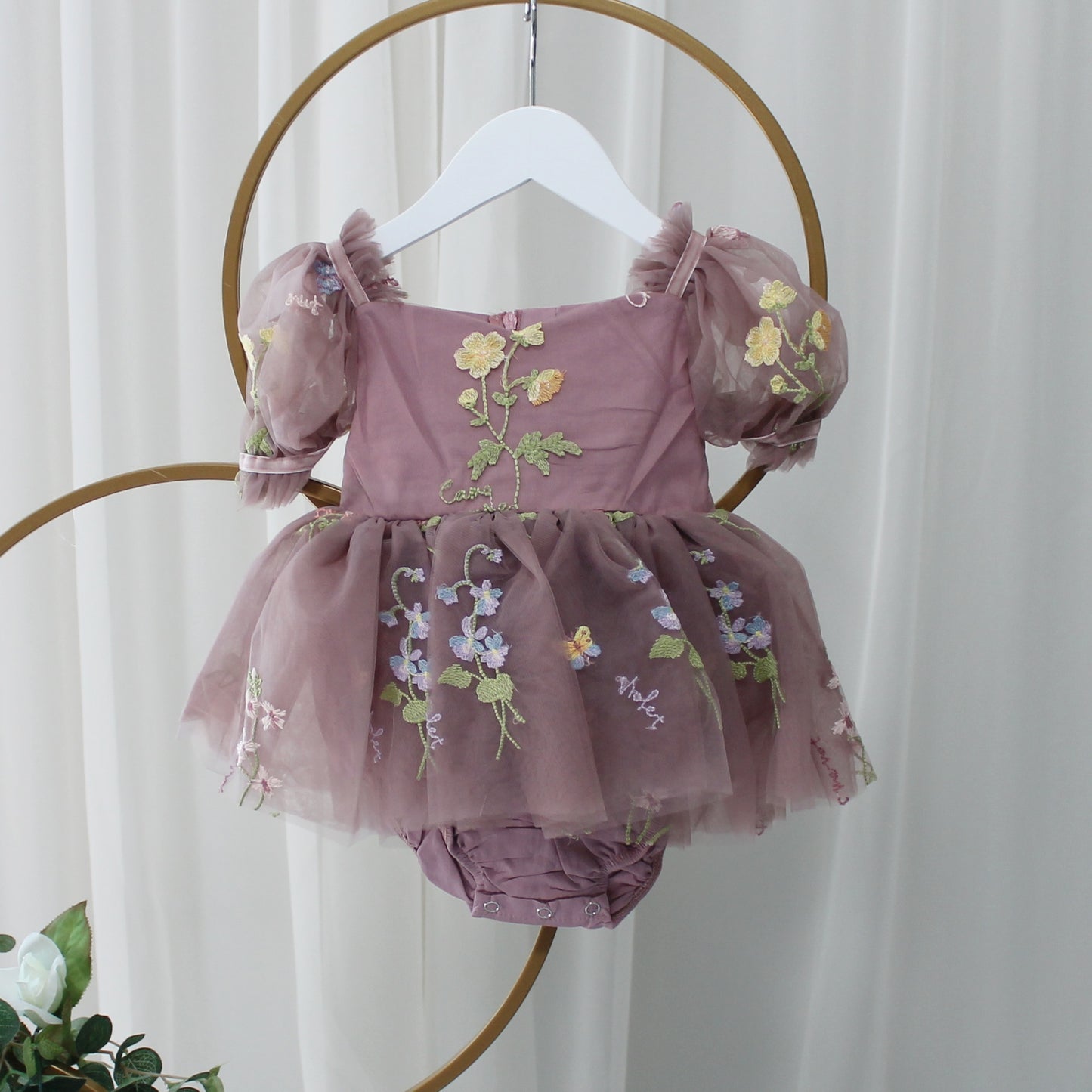 Baby Girl first birthday dress in dusty purple floral embroidery flowers for fairy and wildflower birthday parties.