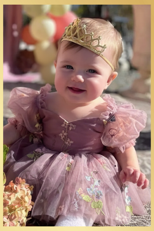 Baby Girl first birthday dress in dusty purple floral embroidery flowers for fairy and wildflower birthday parties.