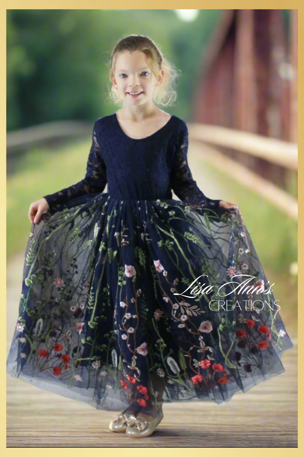 Navy blue floral girls dress with embroidered flowers and greenery on the tulle. Made in a long sleeve lace top in navy with a floral navy full length skirt .
