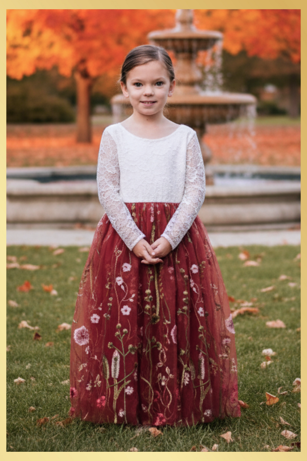flower girl in rust floral embroidery tulle with long lace sleeves and full length dress.