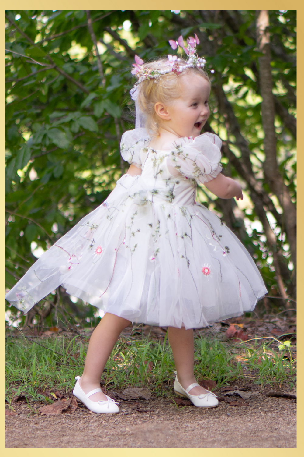 White floral girls and baby dress for flower girls, first birthdays and special occasions.  Sweetheart neckline, puffy sleeves, and knee length style in a fall floral tulle dress.