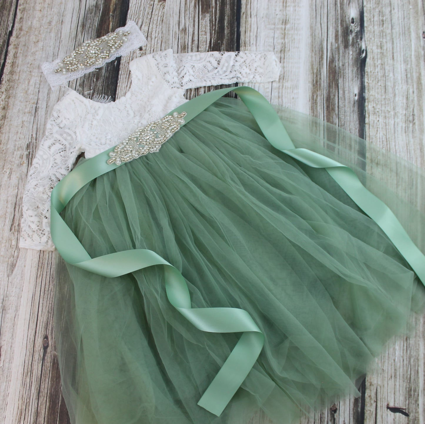 flower girl dress in sage green with rhinestone sash and headband