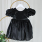 black flower girl dress with puffy sleeves and big bow. 