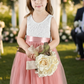 flower girl dress in blush tulle with white sleeveless style. 