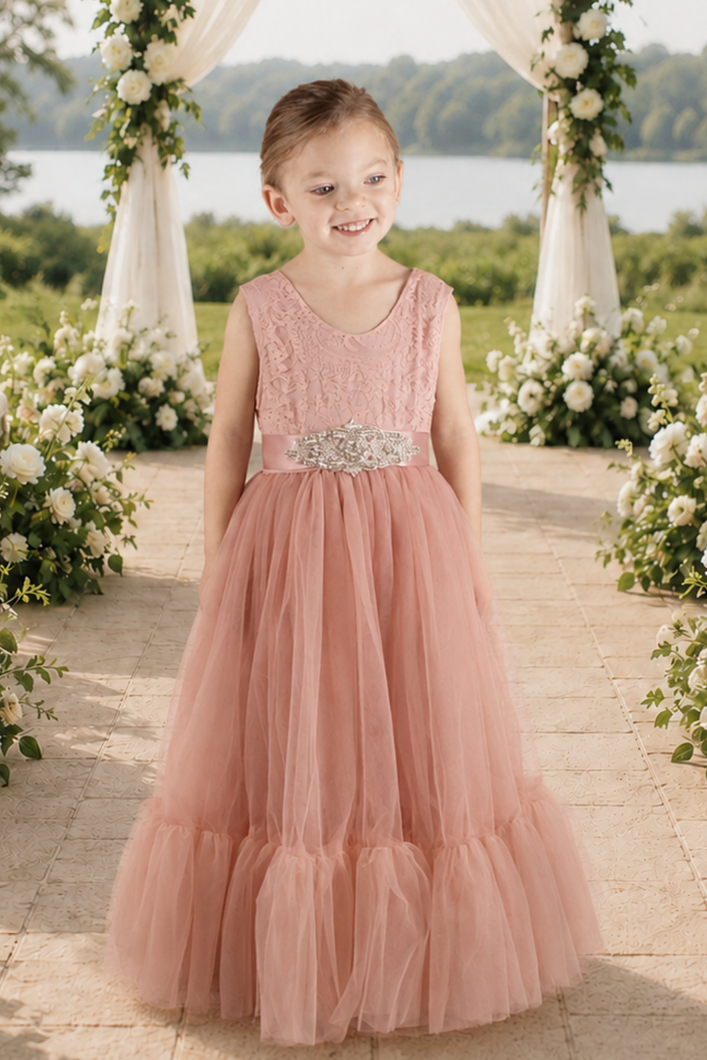 blush flower girl dress in a full mermaid style skirt in sleeveless lace and tulle bottom. 