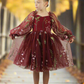 Flower girl dress in burgundy floral. Long tulle sleeves and knee length style dress. 