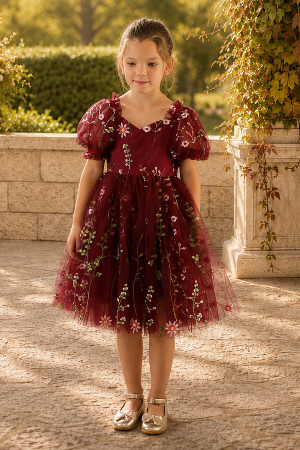 Wildflower flower girl dress in a fall burgundy embroidered floral tulle , knee length style and big puffy short sleeves 