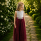 Flower girl dress in burgundy tulle and white lace sleeveless style. 