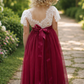 burgundy flower girl dress in tulle and lace short sleeves and full ankle length style. 