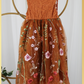 Burnt orange floral embroidery girls' dress. Sleeveless lace sleeves with a floral full length style. perfect for flower girls and special occasions. sizes for babies, toddlers and preteens. 