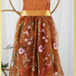 Burnt orange floral embroidery girls' dress. Sleeveless lace sleeves with a floral full length style. perfect for flower girls and special occasions. sizes for babies, toddlers and preteens. 