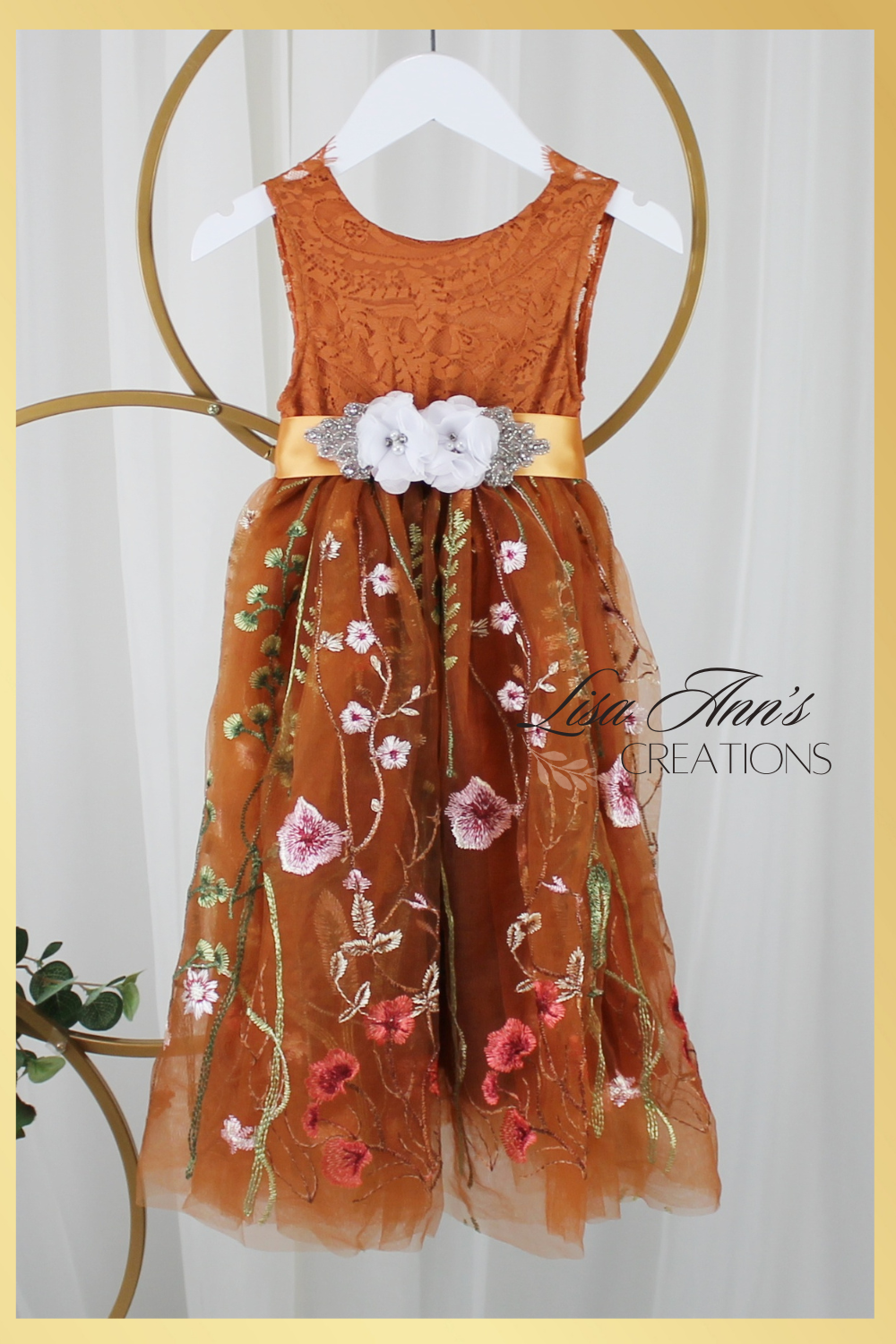 Burnt orange floral embroidery girls' dress. Sleeveless lace sleeves with a floral full length style. perfect for flower girls and special occasions. sizes for babies, toddlers and preteens. 