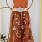 Burnt orange floral embroidery girls' dress. Sleeveless lace sleeves with a floral full length style. perfect for flower girls and special occasions. sizes for babies, toddlers and preteens. 