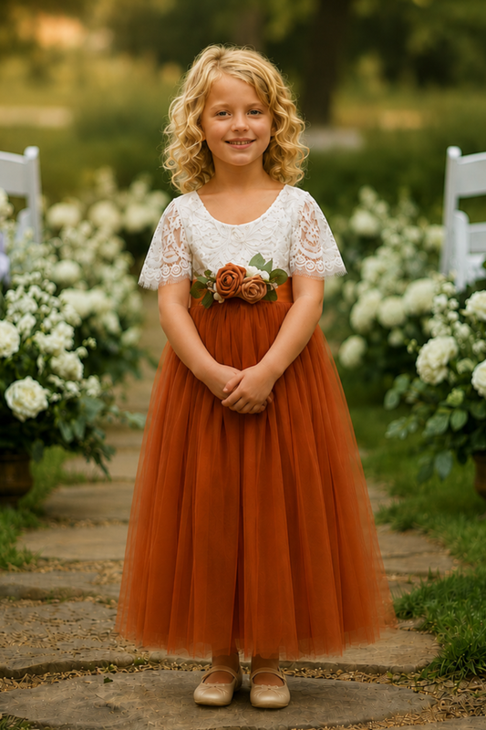 flower girl dress in burnt orange with short white lace sleeves and flowing tulle
