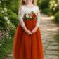 Burnt orange flower girl dress with long lace sleeves and large flower sash