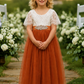 Fall flower girl dress in burnt orange with white lace for an autumn wedding