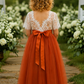 Short sleeve flower girl dress in burnt orange tulle with delicate white lace