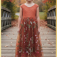Burnt orange floral embroidery girls' dress. Sleeveless lace sleeves with a floral full length style. perfect for flower girls and special occasions. sizes for babies, toddlers and preteens. 