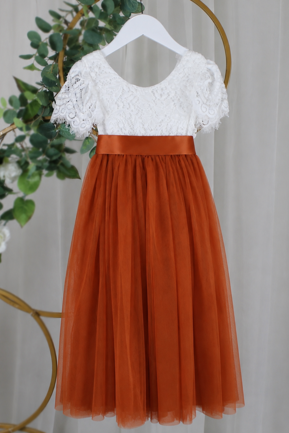 Lace flower girl dress with short sleeves, burnt orange tulle and satin sash