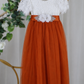 Autumn flower girl dress in burnt orange with short white lace sleeves