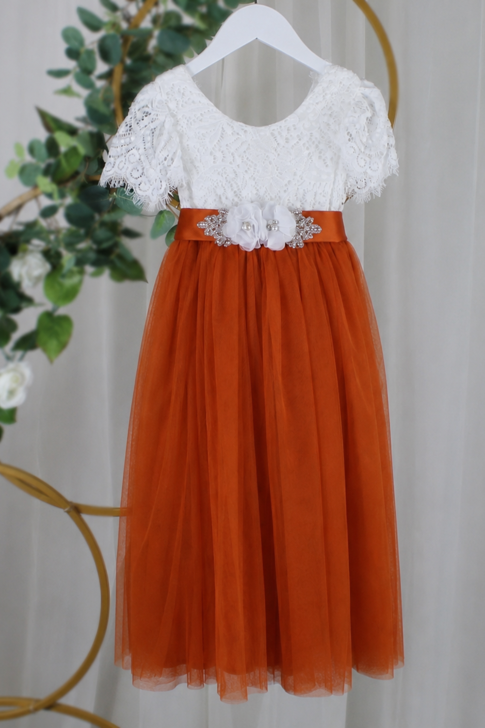 Autumn flower girl dress in burnt orange with short white lace sleeves