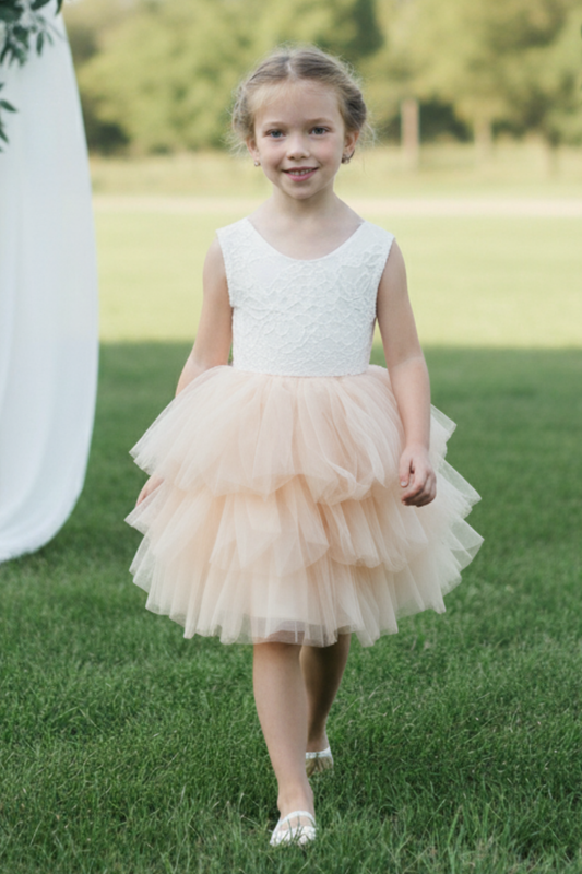 Champagne flower girl dress in a tutu style. With white sleeveless lace top. 