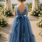 dusty blue flower girl dress in tulle and lace. With a mermaid flair bottom in full length.
