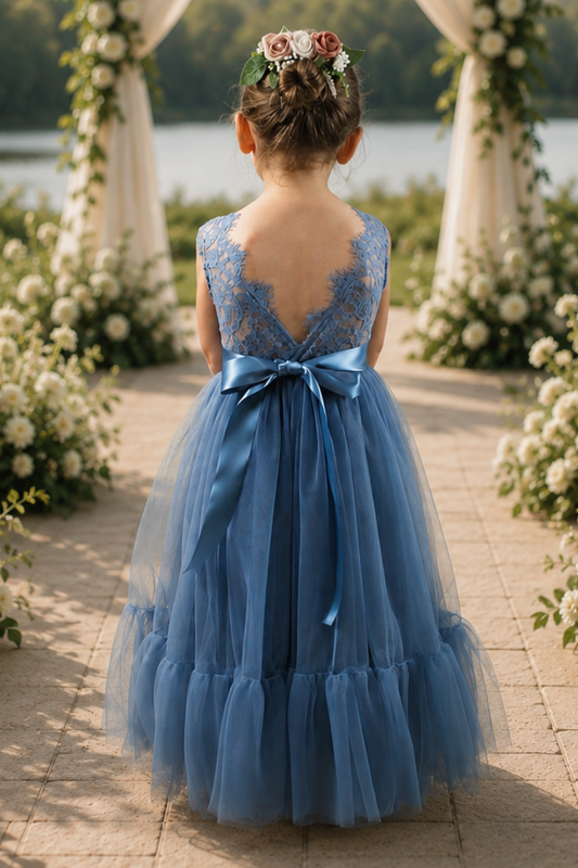 dusty blue flower girl dress in tulle and lace. With a mermaid flair bottom in full length.