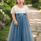 long formal dress for a wedding for a flower girl to wear. In a dusty blue tulle and white short sleeve lace. Full skirt . 