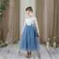 Dusty blue flower girl dress in long tulle with long sleeves in white lace. 