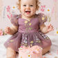 Wildflower first birthday baby girl dress in dusty purple embroidered flowers. 
