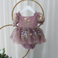Baby Girl first birthday dress in dusty purple floral embroidery flowers for fairy and wildflower birthday parties. 