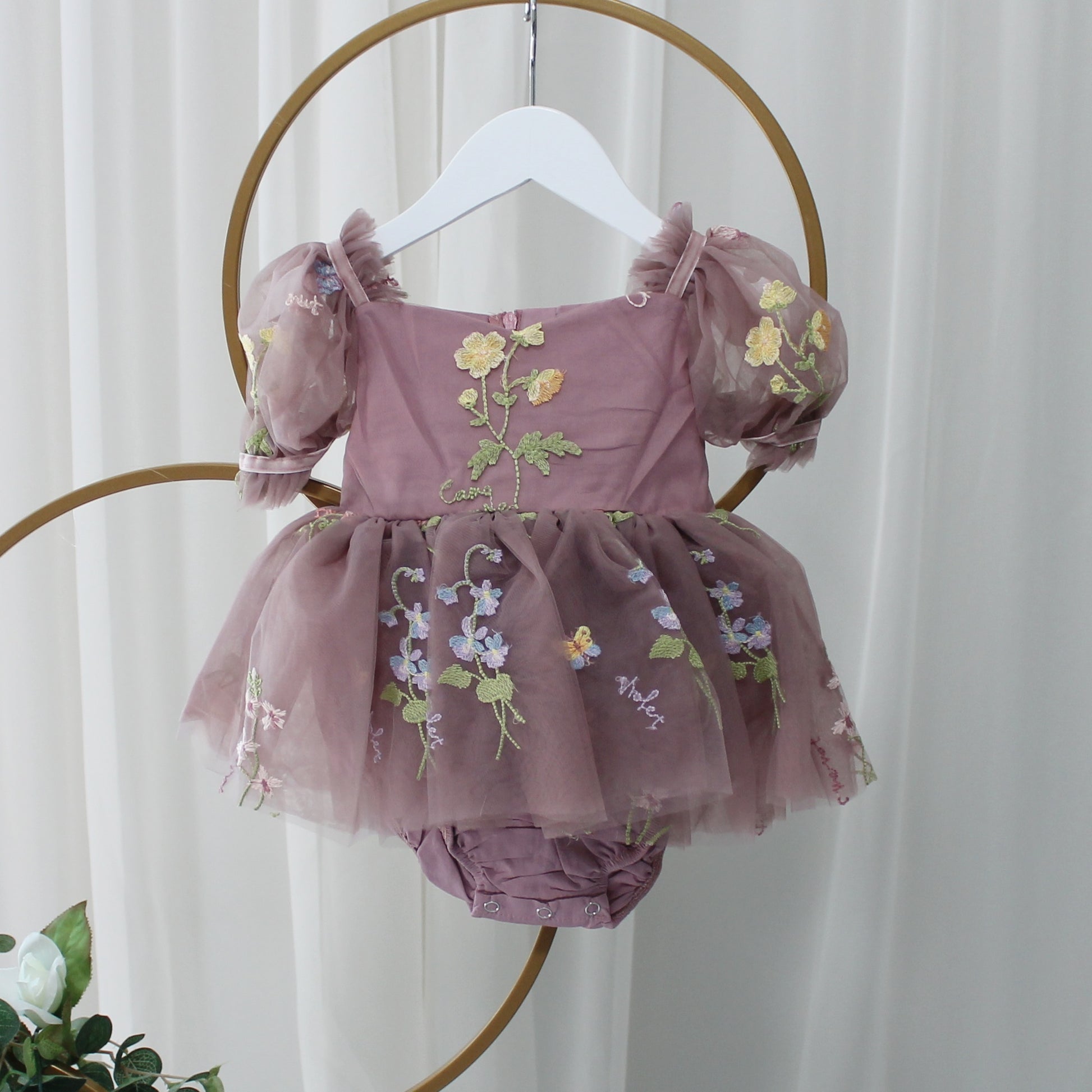 Baby Girl first birthday dress in dusty purple floral embroidery flowers for fairy and wildflower birthday parties. 