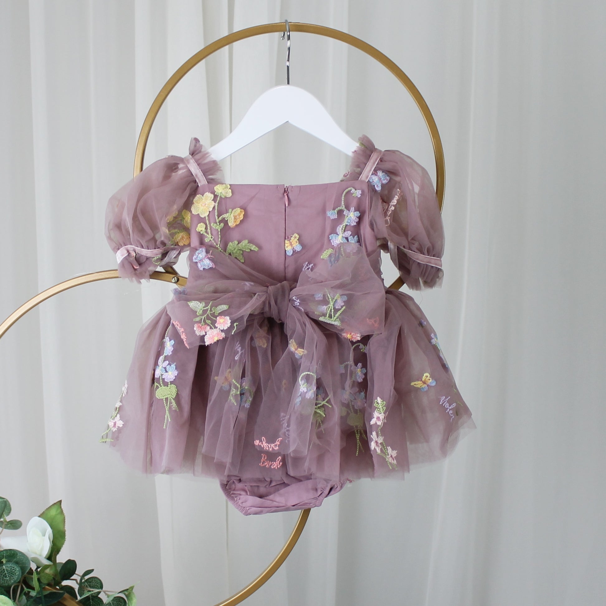 Baby Girl first birthday dress in dusty purple floral embroidery flowers for fairy and wildflower birthday parties. 