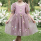 Flower girl dress in a dusty purple floral tulle. 