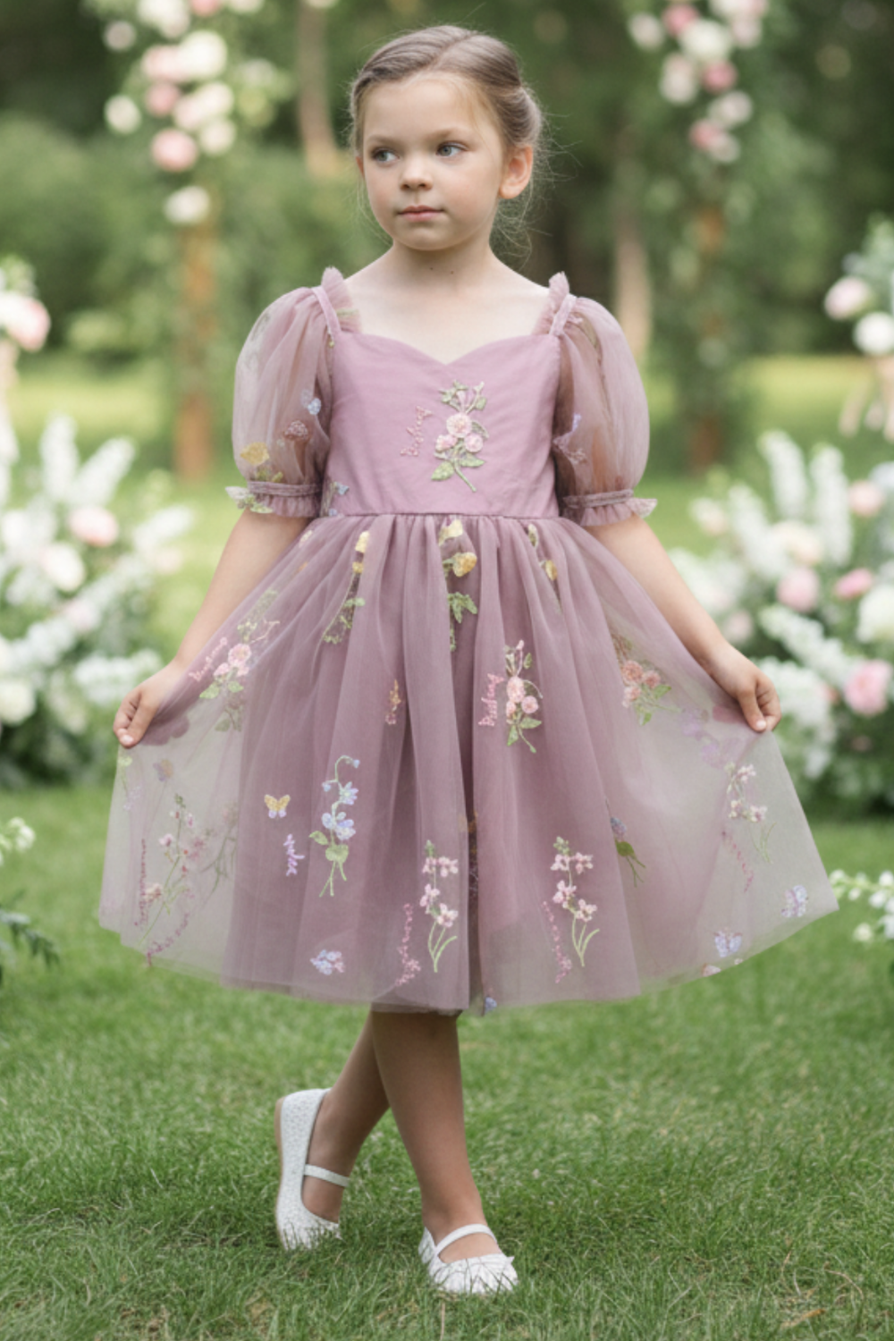 Flower girl dress in a dusty purple floral tulle. 