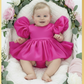 baby girl dress in fuchsia pink. Big puffy sleeves in romper style Organza shiny material. For first birthdays and flower girl dresses for weddings