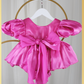 baby girl dress in fuchsia pink. Big puffy sleeves in romper style Organza shiny material. For first birthdays and flower girl dresses for weddings