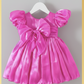 girl dress in fuchsia pink. Big puffy short sleeves, Organza shiny material. For first birthdays and flower girl dresses for weddings