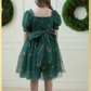 Girls Candy Cane Christmas Dress in green tulle with glitter candy cane pattern. Sweetheart neckline, short sleeves, and knee length style