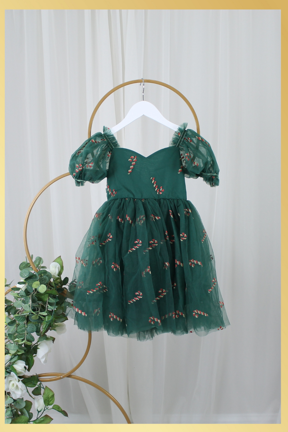 Girls Christmas dress in Green tulle with red and gold candy canes. Shorts Sleeves and knee length style. 