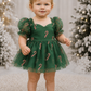 Baby Christmas dress in green tulle with red and gold candy cane details, sweetheart neckline, puff sleeves and built-in bodysuit.