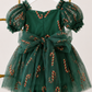 Christmas dress for baby featuring green candy cane tulle, sweetheart neckline, short puff sleeves and built-in bodysuit.