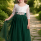 Flower girl dress in hunter green or forest green tulle with a white lace long sleeve dress style is ankle length. 