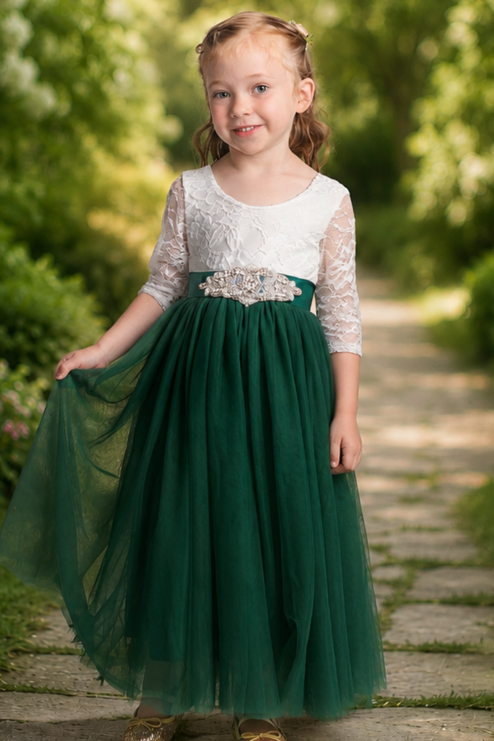 Flower girl dress in hunter green or forest green tulle with a white lace long sleeve dress style is ankle length. 