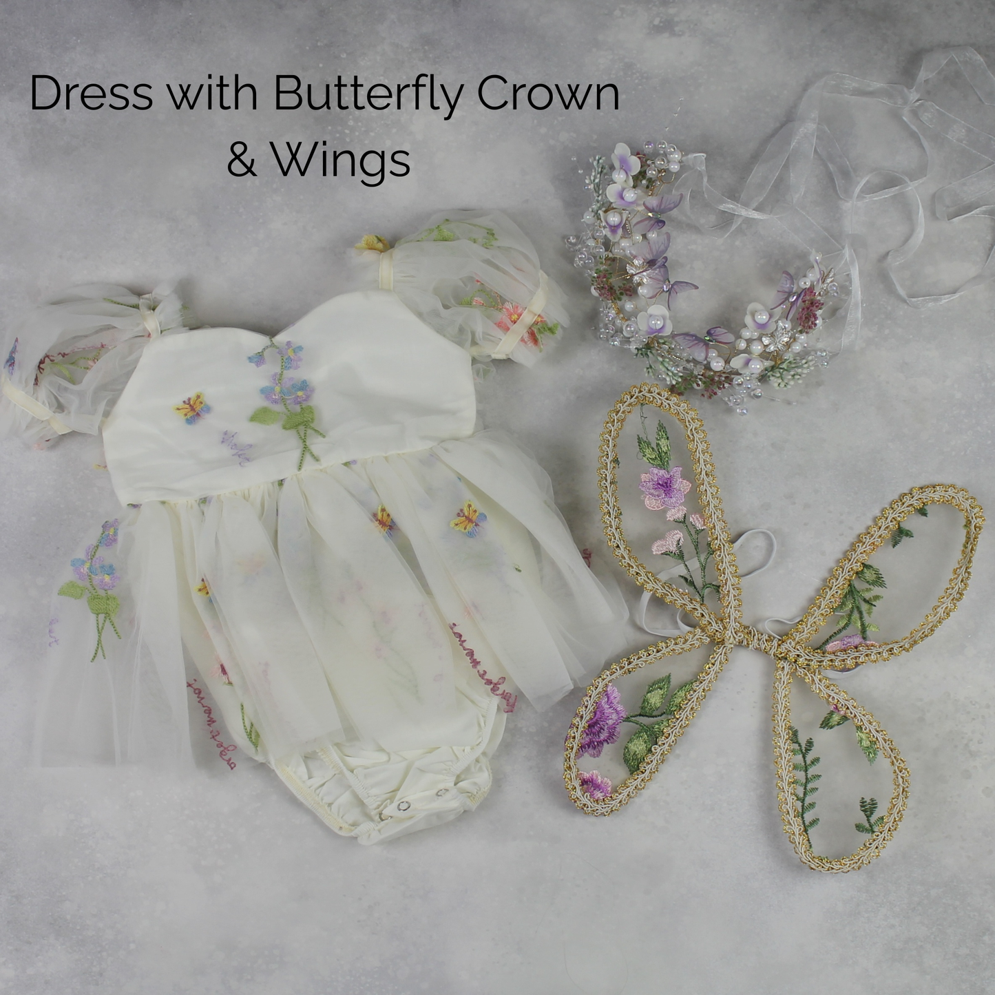 Fairy First birthday baby girls romper dress in ivory floral with wings. 