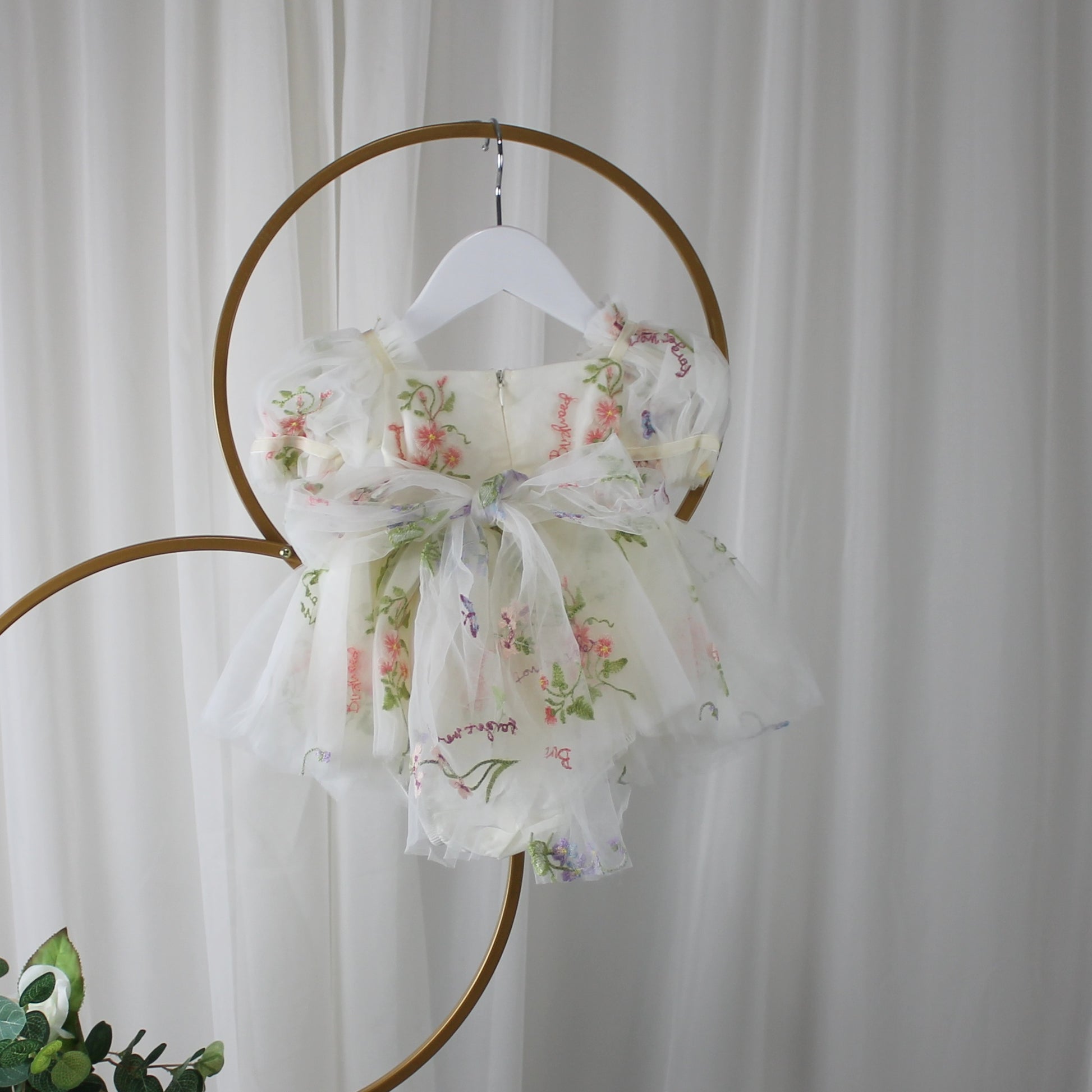 Fairy First birthday baby girls romper dress in ivory floral with wings. 