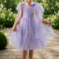 flower girl dress in embroidered floral lavender tulle in a sleeveless knee length style. 